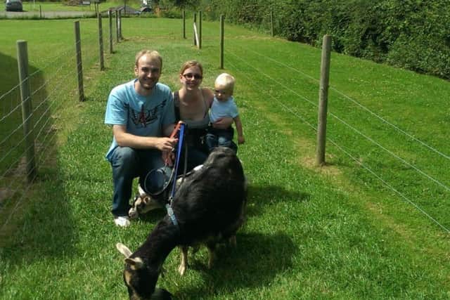 Visitors enjoy a goat walk EMN-180625-151531001