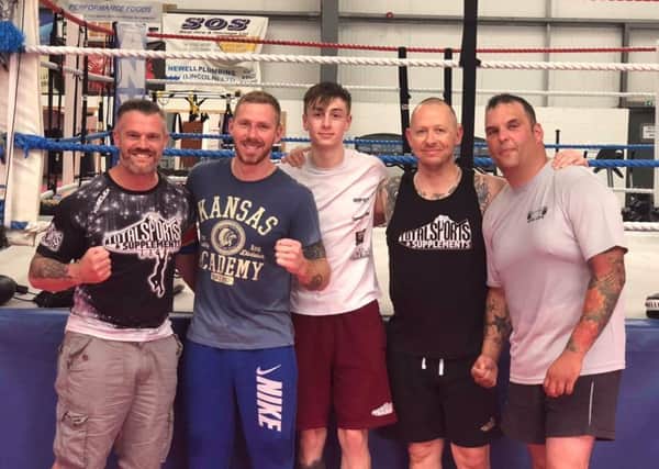 Titich Marshall, local kickboxing champion Phil Robbins, Taylor Sellars, Lea Addlesee and Dean Barnshaw in training for the charity fight night. EMN-180619-095025001