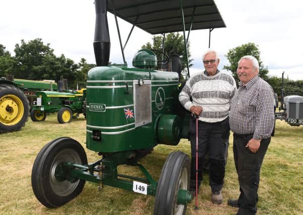 Swaton Vintage Day and World Egg Throwing Championships. From left - Rod Gilbert of Billinghay and David Wakefield with Rod's 1950 Field Marshall series 3. EMN-180618-160148001