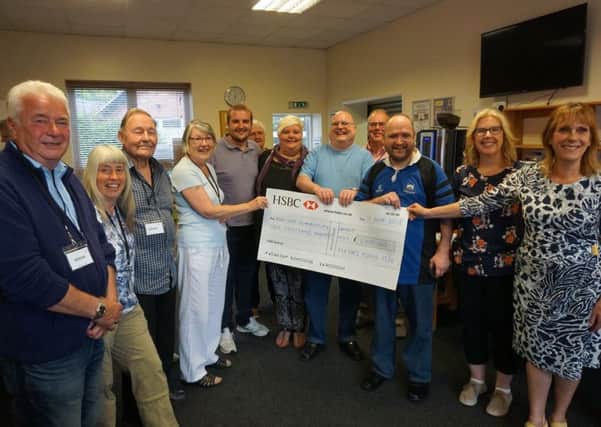 Former Mayor of Sleaford Coun Jan Mathieson presents ?1,000 to The Junction raised from coffee mornings and bingo nights. EMN-180618-205232001
