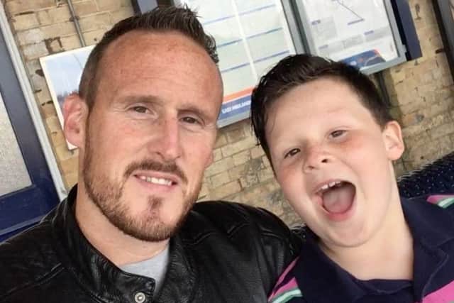 Codie-Lei with his dad Grant on their way down to the film set in London. Image supplied.