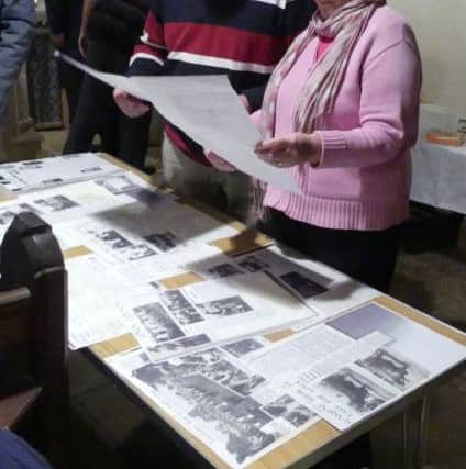 Members of the public look back over archives in Aswarby Church. Image supplied.
