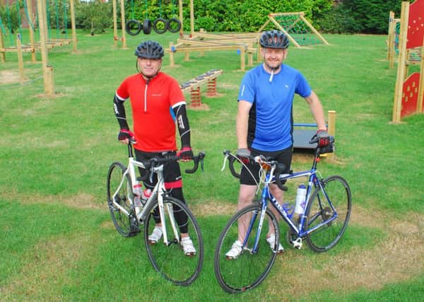 Aiming to cover 130 miles on bikes for Our Lady of Good Counsel School, from left - Nick Spolton and Kevin Skeith. EMN-180625-135510001