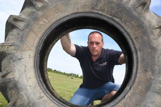 Drivers 4 Defib family fun day. Dan Couling of Anwick. Tyre Flip challenge. EMN-180625-141234001