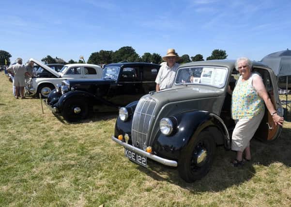 Swaton Vintage Day and World Egg Throwing Championships. Cecil and Marjorie Atkinson of Great Hale with their 1948 Morris 8 Series E. EMN-180625-144806001
