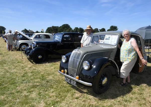 Swaton Vintage Day and World Egg Throwing Championships. Cecil and Marjorie Atkinson of Great Hale with their 1948 Morris 8 Series E. EMN-180625-144806001