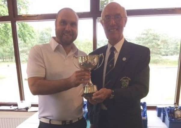 Men's captain Ian Ribey (right) with overall Competition Day winner Brian Inman EMN-180620-161412002