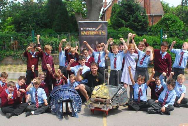 Robot Wars engineer John Findlay, with Matilda, Ripper and William Alvey pupils.