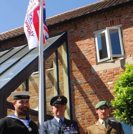 All three services represented for the raising of the Armed Forces Week flag in Sleaford. EMN-180625-135350001