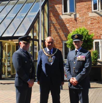 Chairman of NKDC Coun Geoff Hazelwood with representatives of RAF College Cranwell at the Armed Forces Week flag raising. EMN-180625-135301001