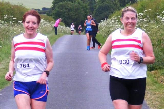 Ruth Edison (left) and Clare Koslow ran the Clickem 10 together EMN-180625-161628002