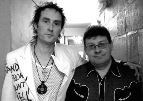 Pictured left is Jock Mclelland from the Band From County Hell with Jake Burns of Stiff Little Fingers backstage when they supported them at Rock City, Nottingham. EMN-180626-144829001