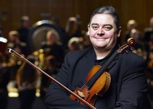 Violinist Andy Long is getting ready for his upcoming concert in Louth.