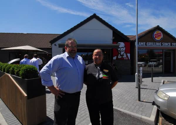 Area manager for the Burger King franchise at Eurogarages, Jason Doe and restaurant manager Maria Lobb outside teh newly opened Burger King and KFC restaurants at Holdingham Roundabout. EMN-180627-133601001