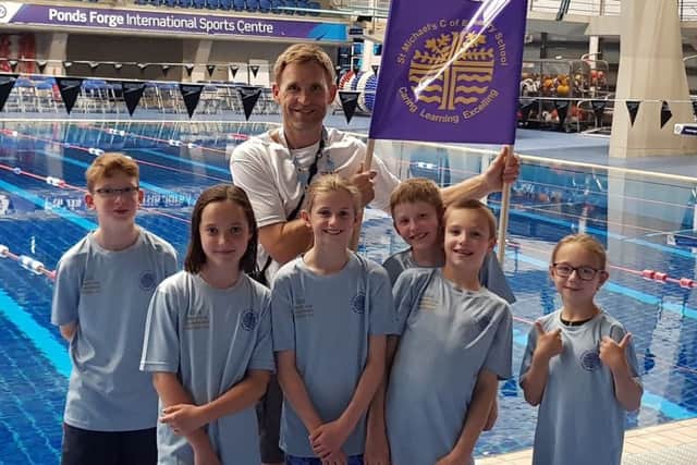 Deputy headteacher John Marritt with the successful St Michael's squad EMN-180629-095123002