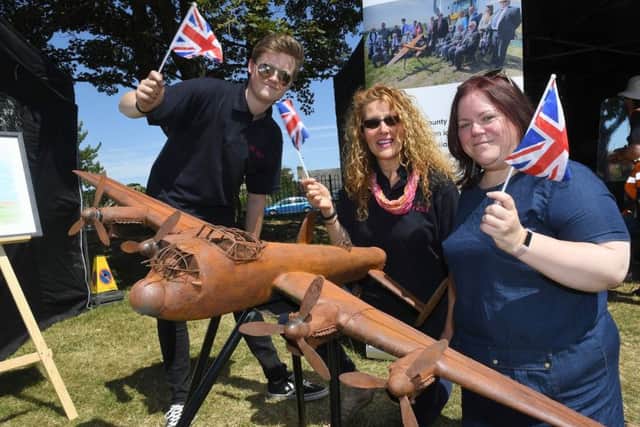 Armed Forces Week community fun day on Boston Road, Rec. L-R Jack Turner, Clare Richarson and Julie Lea of NKDC with replca model of the Lancaster Bomber that is to be build at Norton Disney. EMN-180207-112357001