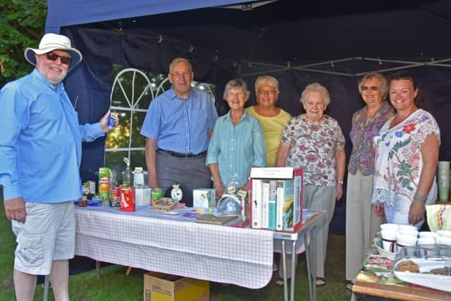 The Rev David Bartlett, left, Rector of the United Parish of Bardney, pictured with helpers at a successful evening fete held at Gatecliff Farm, by kind permission of Jack and Pam Machin. Photo by John Edwards EMN-180507-062644001