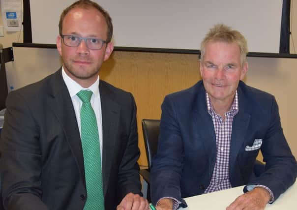 Coun Matthew Lee (left) and Councillor Martin Hill sign the letter to United Lincolnshire Hospitals Trust and South West Lincolnshire Clinical Commissioning Group. EMN-180207-182507001