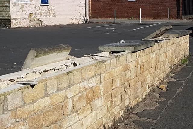 Vandals have wrecked a boundary wall of the Methodist Church Hall in Sleaford by dislodging heavy coping stones as well as leaving broken glass near a primary school and two nurseries. Photo: Mandy Richardson EMN-180307-124226001