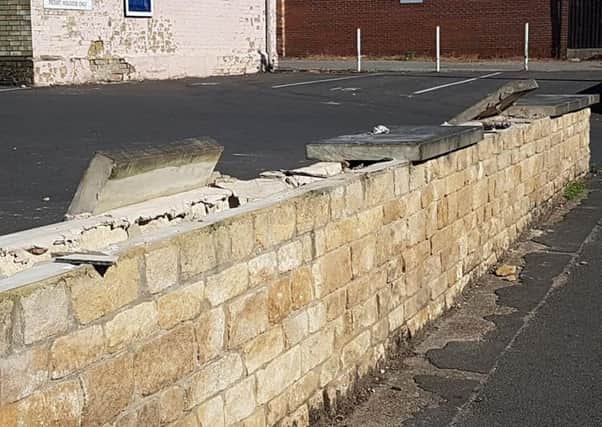 Vandals have wrecked a boundary wall of the Methodist Church Hall in Sleaford by dislodging heavy coping stones as well as leaving broken glass near a primary school and two nurseries. Photo: Mandy Richardson EMN-180307-124226001