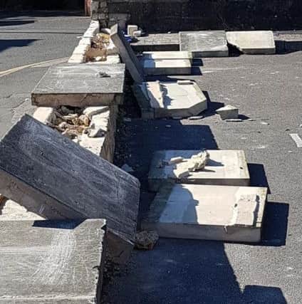 Vandals have wrecked a boundary wall of the Methodist Church Hall in Sleaford by dislodging heavy coping stones as well as leaving broken glass near a primary school and two nurseries. Photo: Mandy Richardson EMN-180307-124216001