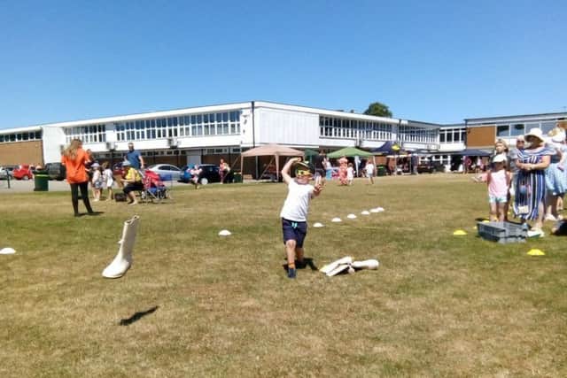 Welly wanging proved very popular at the fun day, with this little boy giving it a go.