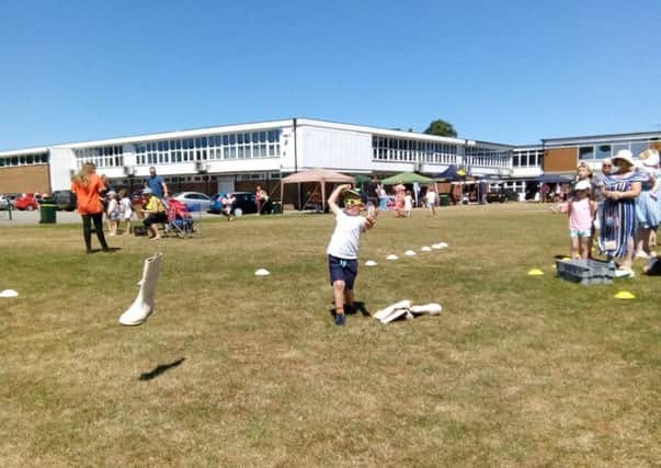 Welly wanging proved very popular at the fun day, with this little boy giving it a go.