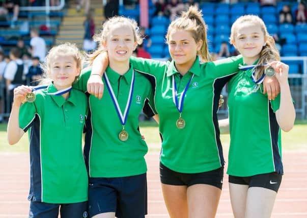 Louth Academy Year 8 relay winners, from left, Molly Donaldson, Scarlet Norman, Molly Jones, Millie Smith.
Picture: Sean Spencer/Hull News & Pictures EMN-180507-100147002
