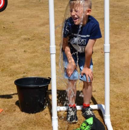 Finn Lowry (7) enjoys a soaking at Lindsey Lodge Hospices Garden Party. EMN-180707-091103001