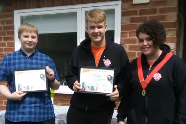 It was a poignant moment for are moving on due to reaching the Leo age limit. New President Amber presented Leo Luke and Leo Christopher
with completion of service certificates and thanked them for all they had done for the club. EMN-181107-154602001