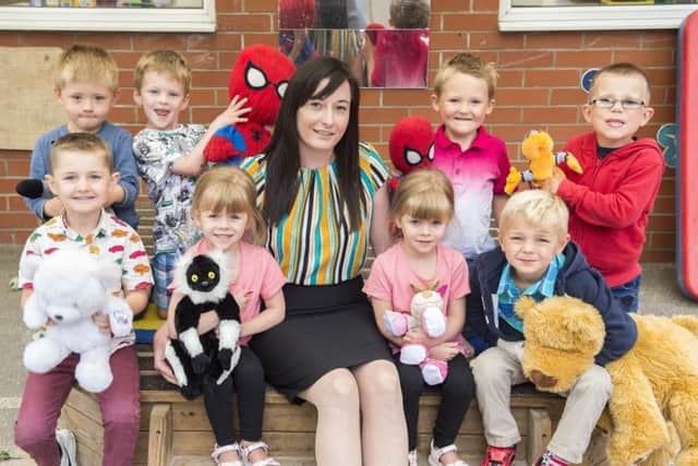 New principal of Theddlethorpe Academy Becky Scott with the new reception class who visited for a taster day and had a teddy bear's picnic.