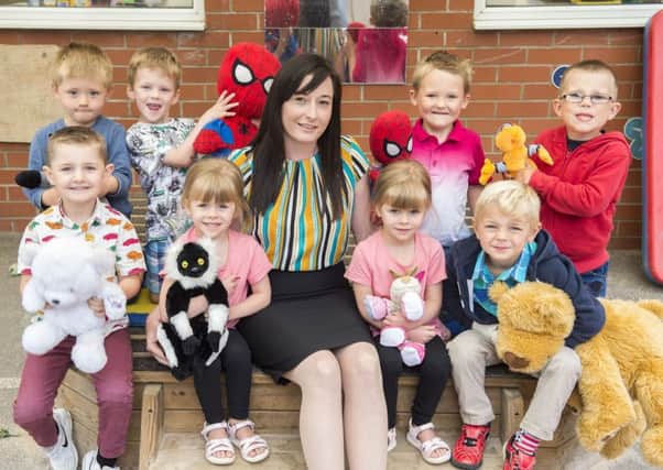 New principal of Theddlethorpe Academy Becky Scott with the new reception class who visited for a taster day and had a teddy bear's picnic.