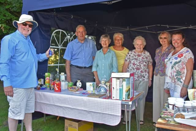 The Rev David Bartlett, left, Rector of the United Parish of Bardney, pictured with helpers at a successful evening fete held at Gatecliff Farm, by kind permission of Jack and Pam Machin. Photo by John Edwards EMN-180507-062644001