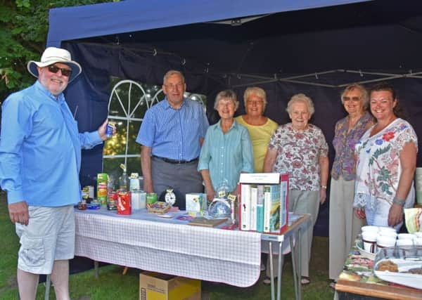 The Rev David Bartlett, left, Rector of the United Parish of Bardney, pictured with helpers at a successful evening fete held at Gatecliff Farm, by kind permission of Jack and Pam Machin. Photo by John Edwards EMN-180507-062644001