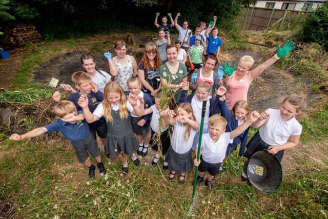 Lincolnshire Co-op staff with Swineshead St Mary's Primary School pupils in the build-up to the new outlet's launch.