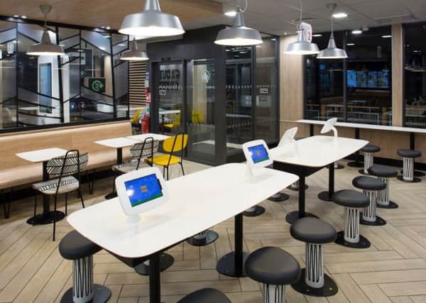 Tablets are among the new features coming to McDonald's, in Boston.