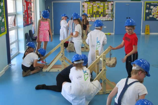 Pupils from Kirton Primary School take on the trebuchet challenge.
