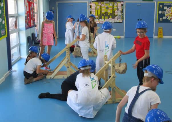 Pupils from Kirton Primary School take on the trebuchet challenge.
