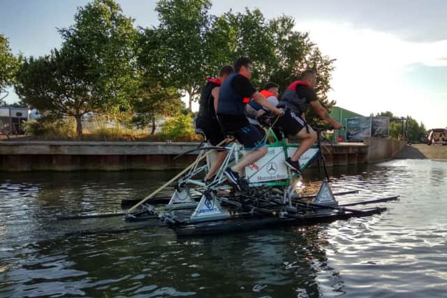 The foursome in action on their Quadmaran.