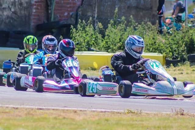 Mablethorpe driver Josh Howell leads main rival Mike North, from Louth EMN-180719-113930002