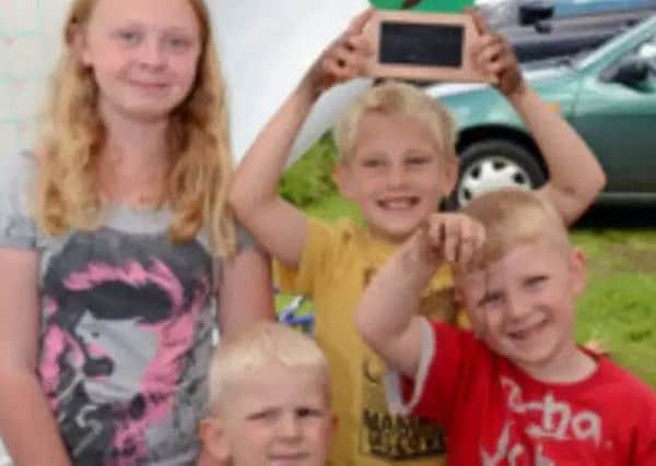 The champions: The Malley family who won the 2012 worm charming title at Woodhall Spa. Pictured are Phoebe (aged 11), Jepherson (3), Jack (9) and William (6). Photo: John Aron. EMN-180719-122133001