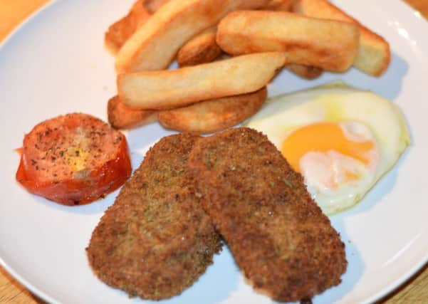 Spicy spam fritters with chips and egg.