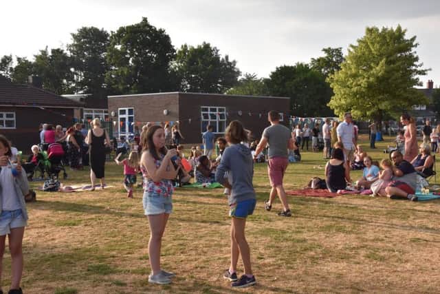 The school sports field was packed with pupils and their relatives enjoying picnics and activities. Picture: John Edwards. EMN-180720-112653001