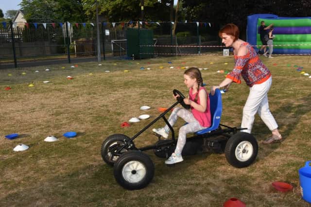 The pedal cars were a popular attraction with pupils. Picture: John Edwards. EMN-180720-112705001