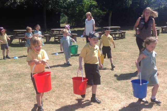 Pupils at Holy Trinity School during the Walk for Water day. EMN-180720-140211001