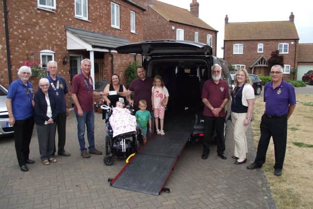 Representatives from the Lions with Olivia (3) and other members of the Butler family at the presentation of the cheque last week. Picture: Bob Wayne.