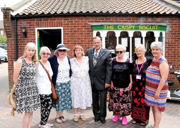 The Mayor of Louth, Councillor George Horton, with Crispy Biscuit owner Susan Turbitt-Mawby and members of the new Louth Friendship Group.