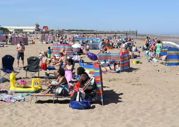 Crowds enjoy the hot weather at the beach. Photo for illustration only.