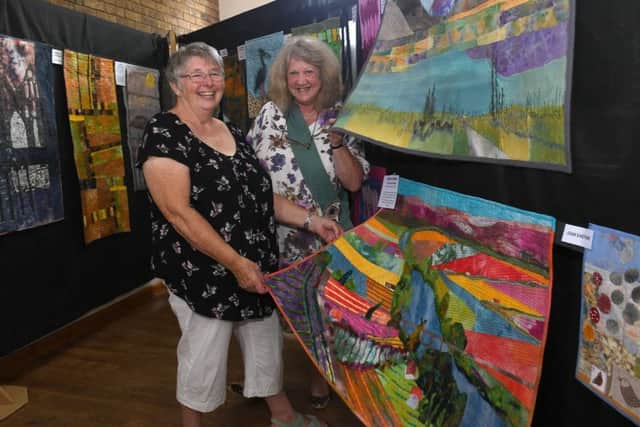 Exhibition of textiles at Cranwell Village Hall and Church. L-R Hilary Proctor and Dreda Farmer - founder members of Crafty Ladies and Cranwell Contemporary Textiles Group. EMN-180723-103321001