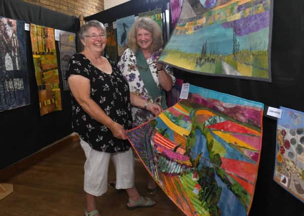 Exhibition of textiles at Cranwell Village Hall and Church. L-R Hilary Proctor and Dreda Farmer - founder members of Crafty Ladies and Cranwell Contemporary Textiles Group. EMN-180723-103321001